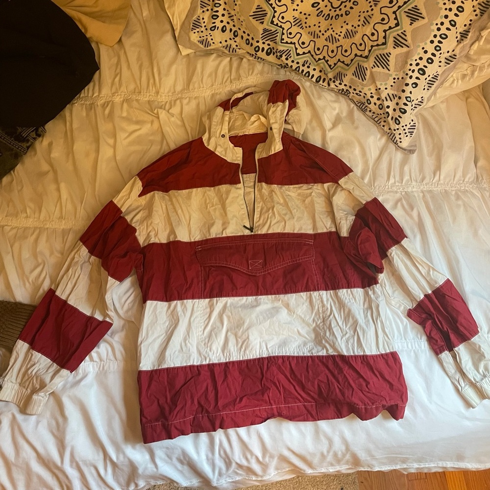 red and white windbreaker